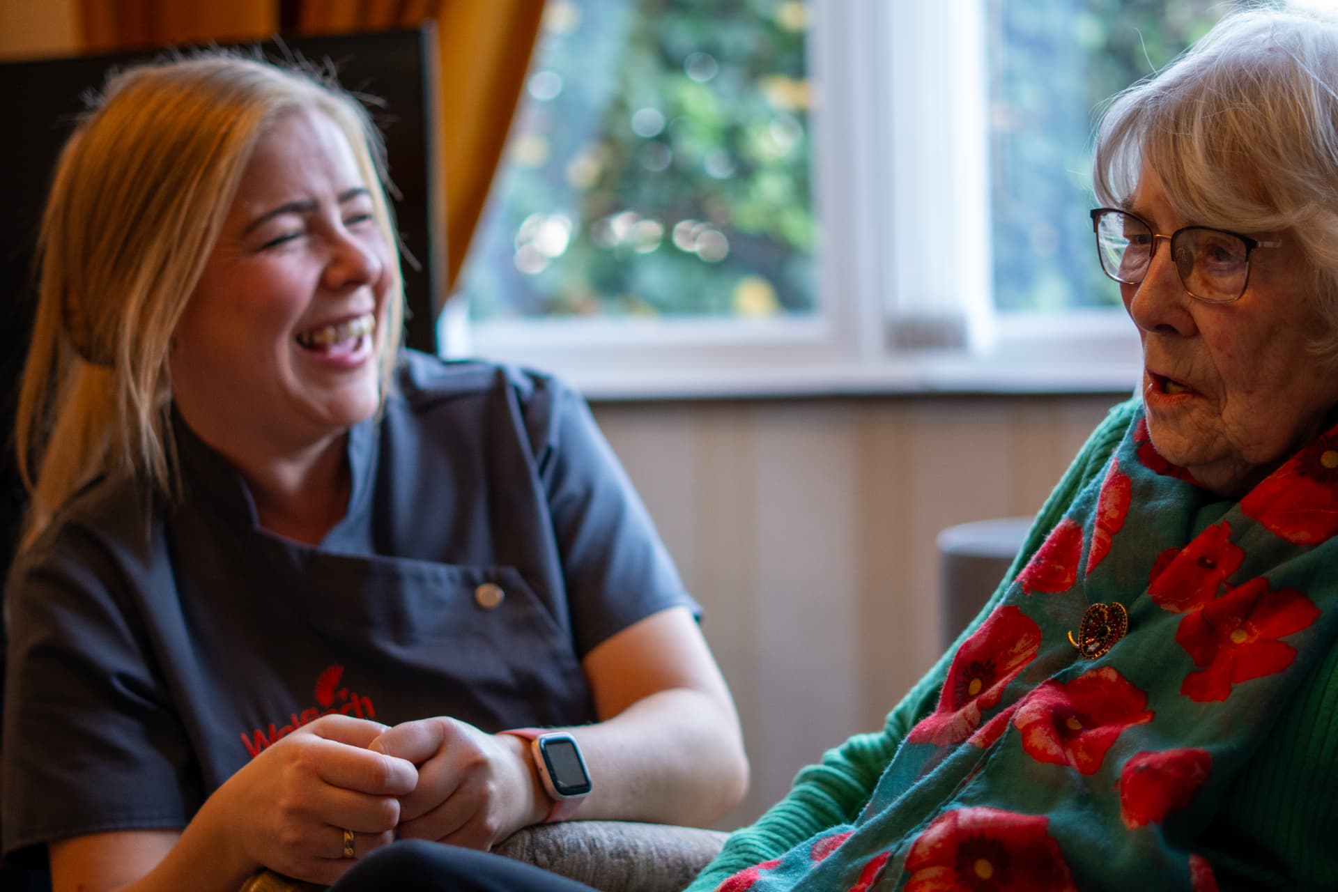 A Walfinch Newcastle carer chatting with an older client at home